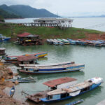 Docked boats by the river in Laos