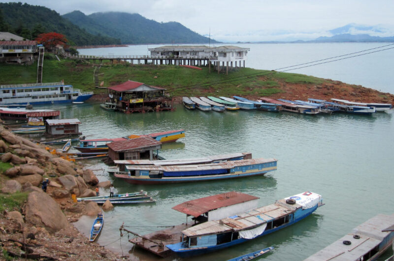 Docked boats by the river in Laos