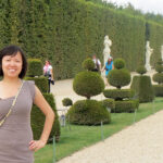 Lush statue garden in Palace of Versailles France