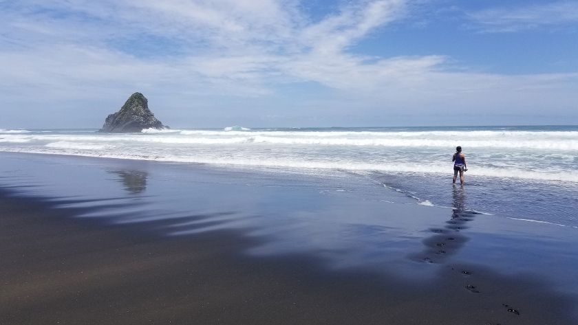 Misty day and strong currents at Karekare Beach in New Zealand