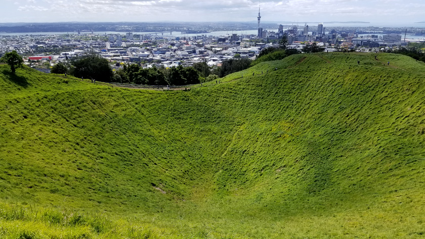 Crater and city skyline at Mount Eden in Auckland New Zealand