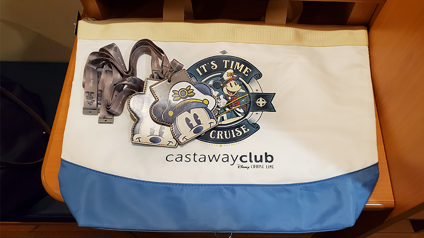 Disney Cruise Line 25th Silver Anniversary at Sea Castaway Club Member free gifts Silver Mickey lanyards and tote bag on board the Disney Magic